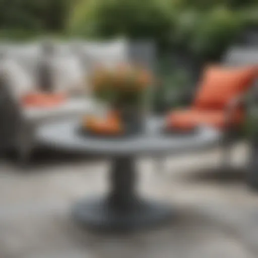 Stylish small gray patio table surrounded by vibrant outdoor decor