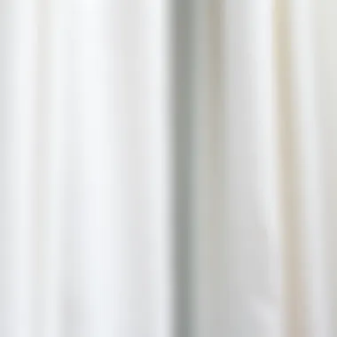 Close-up of textured white curtains draping a window