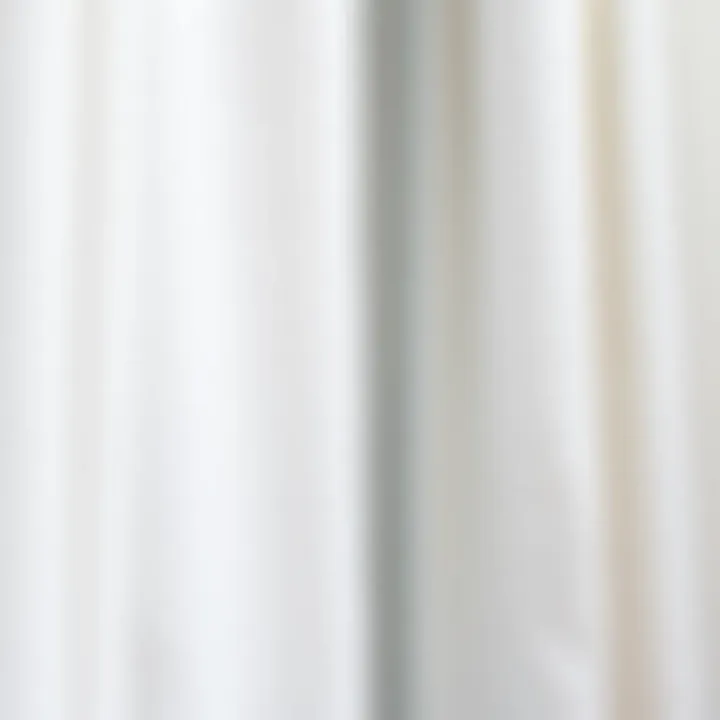 Close-up of textured white curtains draping a window